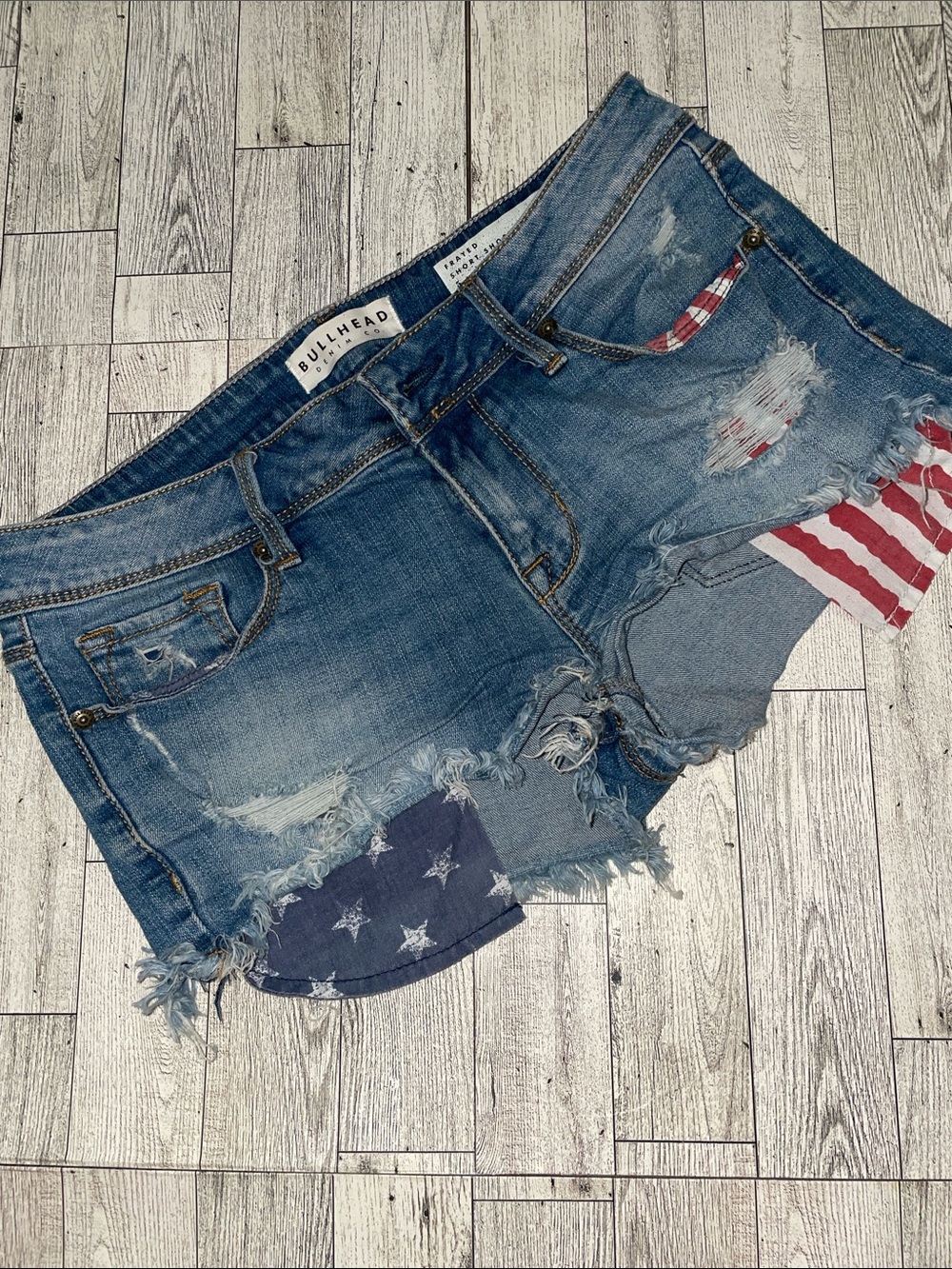 Bullhead Blue Distressed Denim Shorts with USA Flag Patchwork